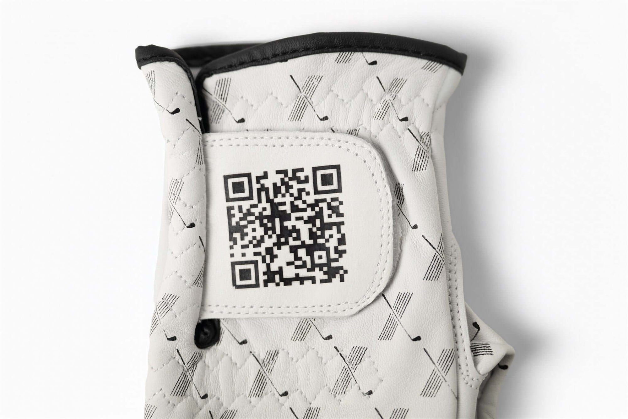 close up of QR code on wrist tab – The Redeemer Glove by 70x7 Golf Co. 