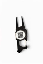 Black golf divot tool with magnetic ball marker featuring a scannable QR code for daily devotionals – The Greenkeeper by 70x7 Golf Co.