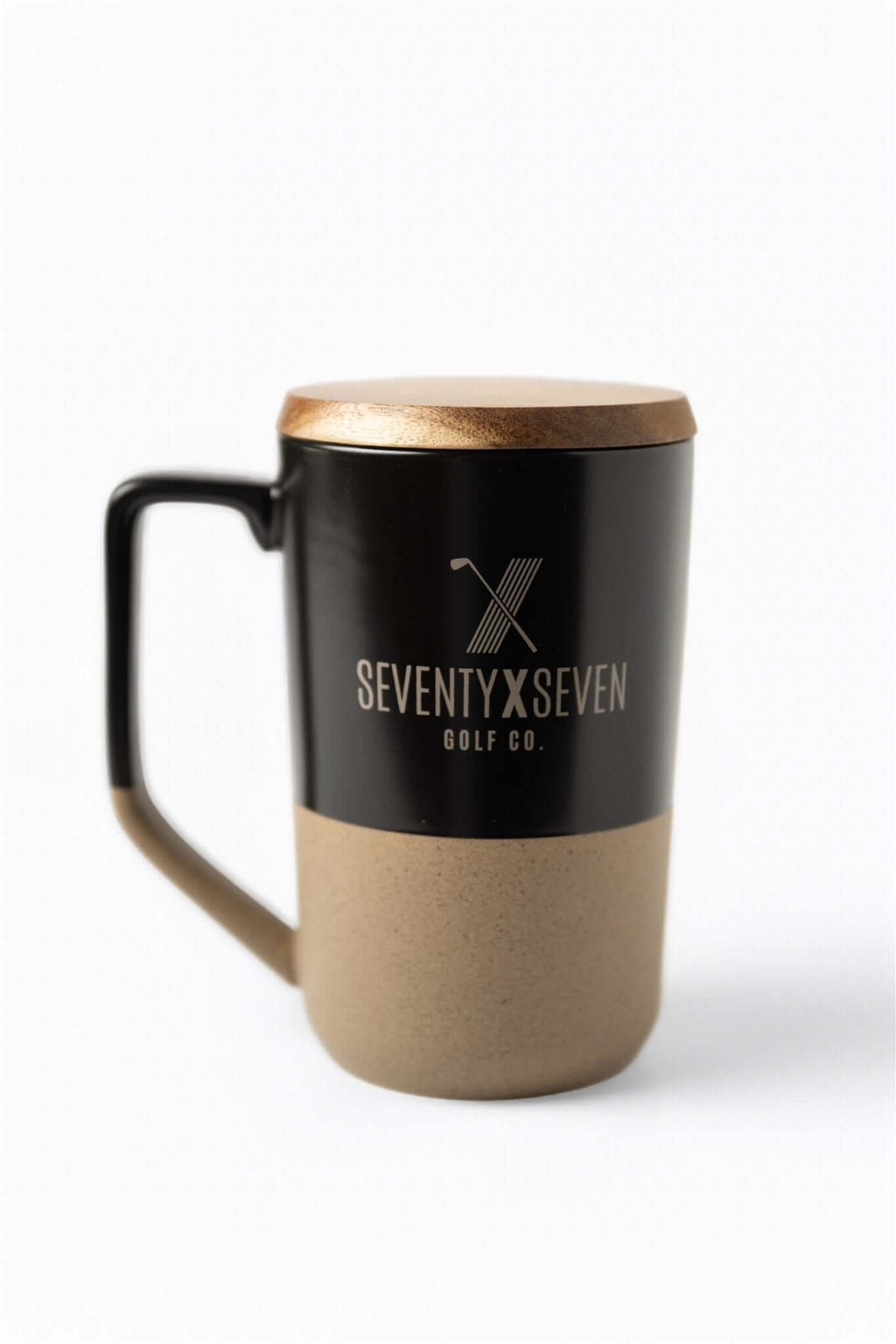 Dual-tone ceramic mug with black top, tan bottom, wooden lid, and SEVENTY X SEVEN Golf Co. logo on front – The Morning Round Mug by 70x7 Golf Co.