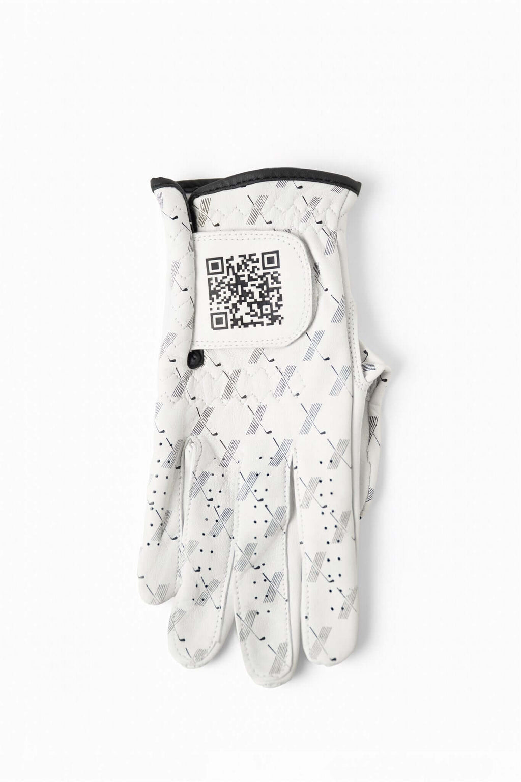 White cabretta leather golf glove with black trim, featuring repeating X pattern and visible QR code on wrist tab – The Redeemer Glove by 70x7 Golf Co. 