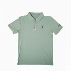 Light green Forgiveness golf polo shirt with classic collar, zippered placket, 70x7 Golf Co. logo on chest, and SEVENTYXSEVEN text on sleeve