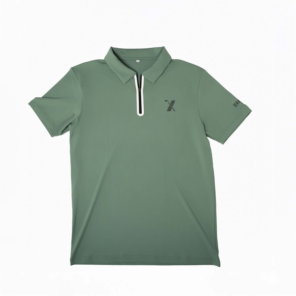 Green Forgiveness golf polo shirt with classic collar, zippered placket, 70x7 Golf Co. logo on chest, and SEVENTYXSEVEN text on sleeve