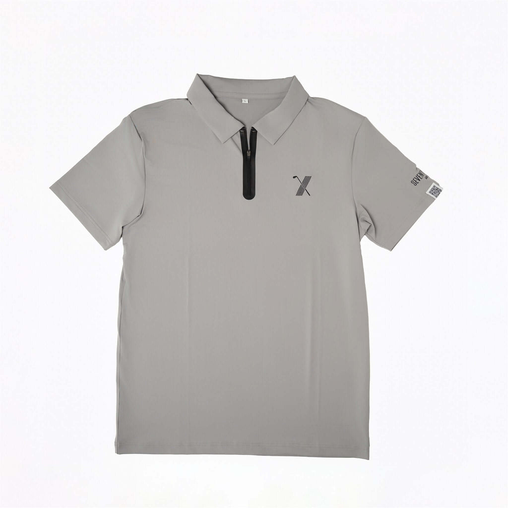 Gray Forgiveness golf polo shirt with classic collar, zippered placket, 70x7 Golf Co. logo on chest, and SEVENTYXSEVEN text on sleeve
